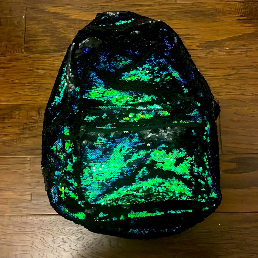iridescent flipping sequin backpack.